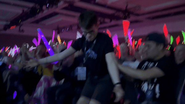 James Conlin standing at an event with the text "James the Voice" overtop. 